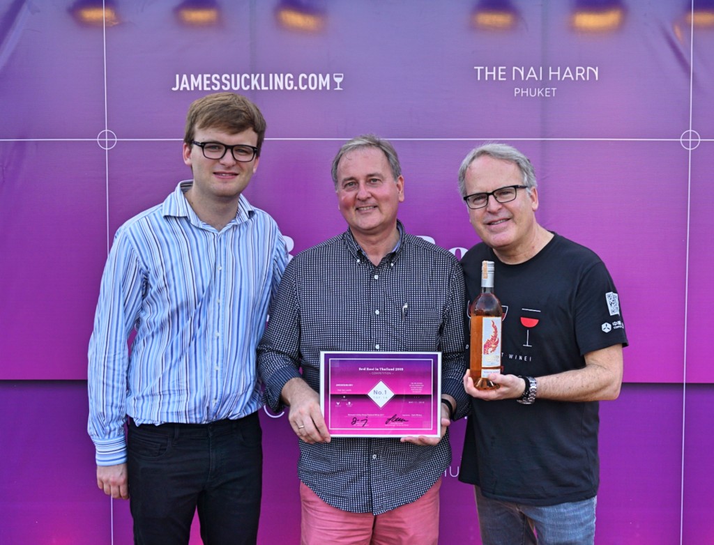 Jack Suckling (left), Frank Grassmann (center) General Manager of The Nai Harn Phuket, and James Suckling (right) announce the surprise win for a Thai wine